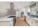 Well-appointed kitchen featuring stainless steel appliances, a large island, and stylish countertops for modern living at 6989 300 Th N Ave, Clearwater, FL 33761