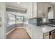 Bright eat-in kitchen featuring modern countertops, ample cabinet space, and a sun-filled bay window at 6989 300 Th N Ave, Clearwater, FL 33761