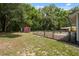 Spacious backyard with a charming shed and fenced area, perfect for outdoor activities at 7340 20Th, Zephyrhills, FL 33540