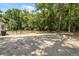 Expansive backyard featuring a shed, a fenced dog run, and ample space for outdoor activities at 7340 20Th, Zephyrhills, FL 33540