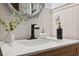 Charming bathroom featuring a white vanity with a quartz countertop and stylish decor at 7340 20Th, Zephyrhills, FL 33540