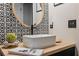 Elegant bathroom featuring decorative wall tiles, modern vanity, and stylish fixtures at 7340 20Th, Zephyrhills, FL 33540