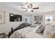 Comfortable bedroom features decorative wall, ceiling fan, and natural light at 7340 20Th, Zephyrhills, FL 33540