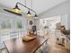 Bright dining area with modern lighting and a view of the kitchen at 7340 20Th, Zephyrhills, FL 33540