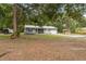 Charming house with a screened-in porch and a long, newly paved driveway at 7340 20Th, Zephyrhills, FL 33540