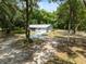 Charming house on a sprawling lot, surrounded by mature trees at 7340 20Th, Zephyrhills, FL 33540
