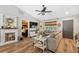 Open living room with a decorative fireplace and a view to the bedroom at 7340 20Th, Zephyrhills, FL 33540