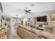 Spacious open-concept living room with modern furnishings, hardwood floors and lots of natural light at 7340 20Th, Zephyrhills, FL 33540