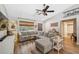 Comfortable living room featuring a large sectional sofa and stylish decor at 7340 20Th, Zephyrhills, FL 33540