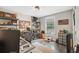 Functional office featuring wood floors, shelving, and a window offering natural light at 7340 20Th, Zephyrhills, FL 33540