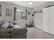Bedroom featuring neutral walls, natural light, and modern furniture at 7736 Chadwick Dr, New Port Richey, FL 34654