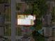 Overhead view of the property highlighting its layout, landscaping, and surrounding neighborhood at 7979 Avenal Loop, New Port Richey, FL 34655