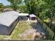 Aerial view of backyard featuring a covered patio area with furniture and fenced yard at 7979 Avenal Loop, New Port Richey, FL 34655