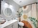 A quaint bathroom featuring a modern art shower curtain at 7979 Avenal Loop, New Port Richey, FL 34655