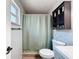 Cozy bathroom showcasing tiled walls and decorative shelf at 7979 Avenal Loop, New Port Richey, FL 34655