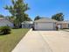Charming single-story home with a well-manicured lawn and a spacious driveway at 7979 Avenal Loop, New Port Richey, FL 34655