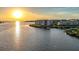 Waterfront property featuring building exteriors, surrounding water, and the bright sun at 8211 Brent St # 836, Port Richey, FL 34668