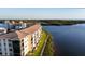 Riverside condo building with green space and scenic views of the water at 8211 Brent St # 836, Port Richey, FL 34668