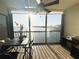 Relaxing screened balcony with water views, ceiling fan and outdoor dining set at 8211 Brent St # 836, Port Richey, FL 34668