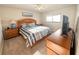 Bedroom with a ceiling fan, neutral paint and large windows offering both natural light and comfort at 8211 Brent St # 836, Port Richey, FL 34668