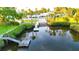 The dock on the water's edge features a boat ramp and a wooden pier with access to the water at 8211 Brent St # 836, Port Richey, FL 34668
