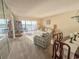 Bright living room with water views, comfortable seating, and adjacent dining area at 8211 Brent St # 836, Port Richey, FL 34668