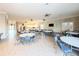 Spacious gathering space with tables, chairs, a kitchen area, and plenty of room to entertain at 8211 Brent St # 836, Port Richey, FL 34668