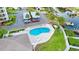 Community pool with lounge chairs offers a relaxing outdoor space for residents at 8211 Brent St # 836, Port Richey, FL 34668