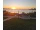 Breathtaking sunset view overlooking the waterfront with lush landscaping and a charming bench at 8211 Brent St # 836, Port Richey, FL 34668
