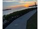 A lovely waterfront walkway with a sunset view at 8211 Brent St # 836, Port Richey, FL 34668