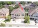 Aerial view of townhomes featuring 3 garages and second floor balcony at 8409 Blue Rock Dr, New Port Richey, FL 34653