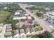 Aerial view of townhomes featuring lush landscaping, and close proximity to major roads at 8409 Blue Rock Dr, New Port Richey, FL 34653