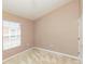 Carpeted bedroom featuring one window and neutral paint at 8409 Blue Rock Dr, New Port Richey, FL 34653