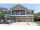 Inviting townhouse featuring a private balcony and attached garages, set in a well-maintained community at 8409 Blue Rock Dr, New Port Richey, FL 34653