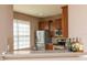 Kitchen view features a breakfast bar, stainless steel appliances, and bar counter at 8409 Blue Rock Dr, New Port Richey, FL 34653