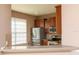 Modern kitchen featuring stainless steel appliances, granite countertops, and wood cabinets at 8409 Blue Rock Dr, New Port Richey, FL 34653
