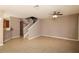 Open-concept living area with tile flooring, and stairway at 8409 Blue Rock Dr, New Port Richey, FL 34653