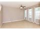 Bright and airy living space featuring tiled flooring and ample natural light at 8409 Blue Rock Dr, New Port Richey, FL 34653