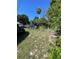 Fenced backyard showing a vehicle parked, with room for landscaping at 8711 Jolly Roger Dr, Hudson, FL 34667