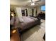 Standard bedroom with hardwood floors and a walk-in closet at 8711 Jolly Roger Dr, Hudson, FL 34667