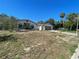 Charming single-story home with mature landscaping and an attached garage at 8711 Jolly Roger Dr, Hudson, FL 34667