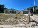 Ranch style home with an arched window, drought-tolerant landscaping and a two car garage at 8711 Jolly Roger Dr, Hudson, FL 34667