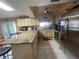 Well-lit kitchen with stainless steel appliances and granite countertops at 8711 Jolly Roger Dr, Hudson, FL 34667