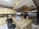 Well-lit kitchen with stainless steel appliances and granite countertops at 8711 Jolly Roger Dr, Hudson, FL 34667
