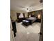Bedroom with tile flooring, ceiling fan, and dark brown furniture at 8711 Jolly Roger Dr, Hudson, FL 34667