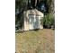 Durable outdoor shed with wide door, providing extra storage space at 8711 Jolly Roger Dr, Hudson, FL 34667