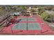 Enjoy community pickleball courts, perfect for recreation and exercise, surrounded by mature trees and landscaping at 8807 Village Mill Row, Hudson, FL 34667