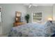 Cozy bedroom with a dresser, a window overlooking the yard, and comfortable furnishings at 9019 Flagstick Ln, Hudson, FL 34667