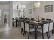 Elegant dining room with a large table, seating for ten, and mirrored wall at 9019 Flagstick Ln, Hudson, FL 34667