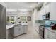 Well-lit kitchen with granite countertops, stainless steel appliances, and an open concept design at 9019 Flagstick Ln, Hudson, FL 34667
